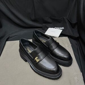 CHANEL Black Leather Loafers with Gold Logo